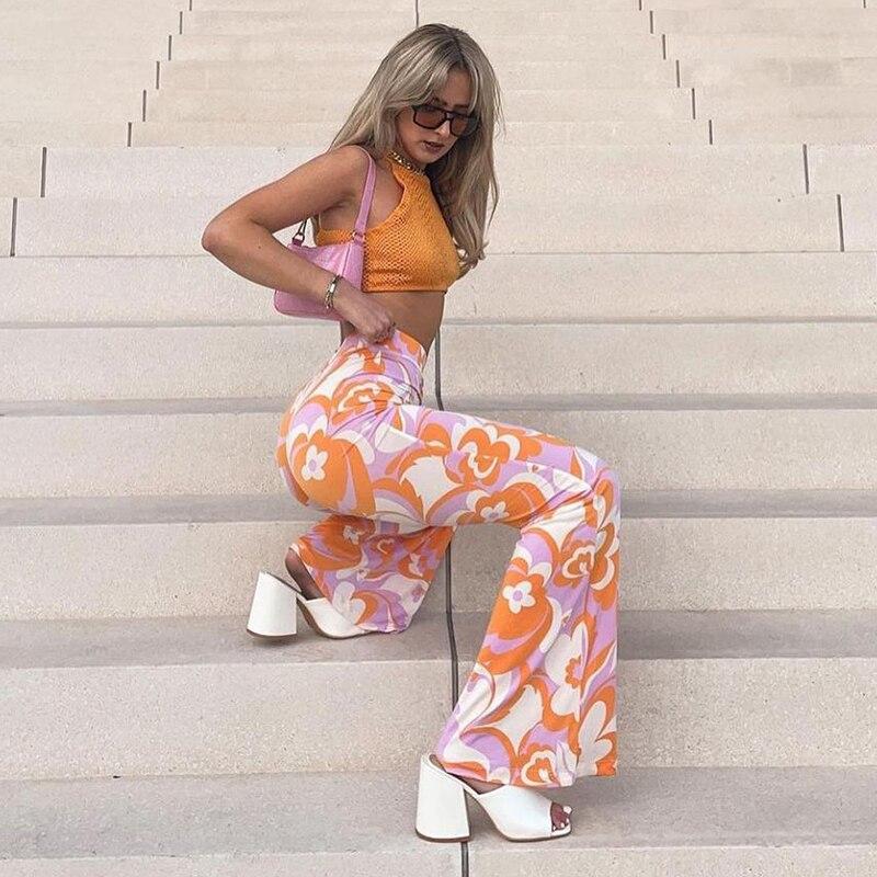 Orange and pink High Waist Floral Boot Cut Pants on sexy woman posing on stairs