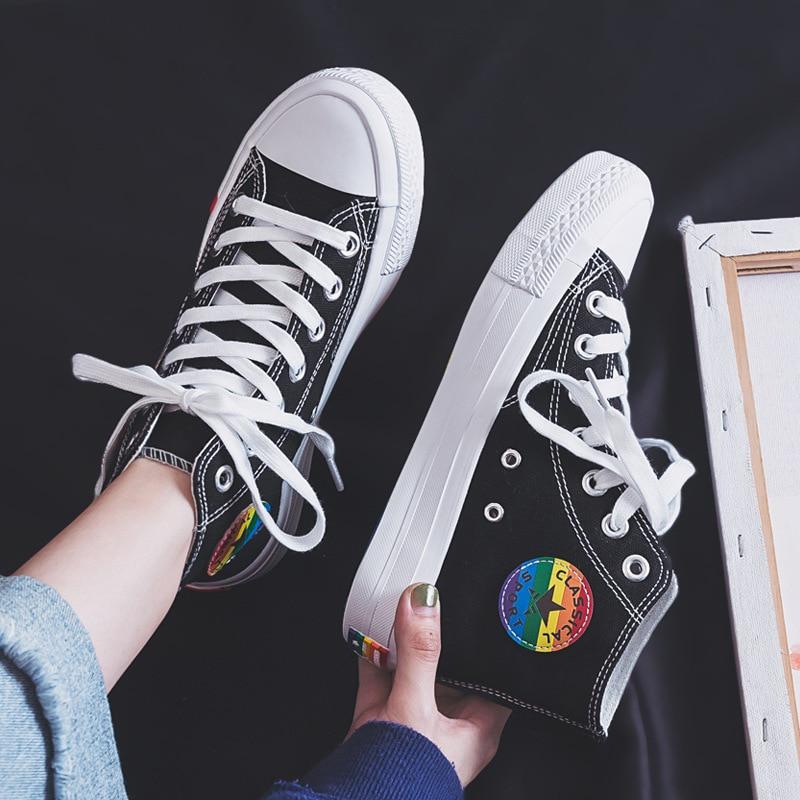 black classical high top converse style sneakers with a rainbow decoration in rainbow aesthetics fashion