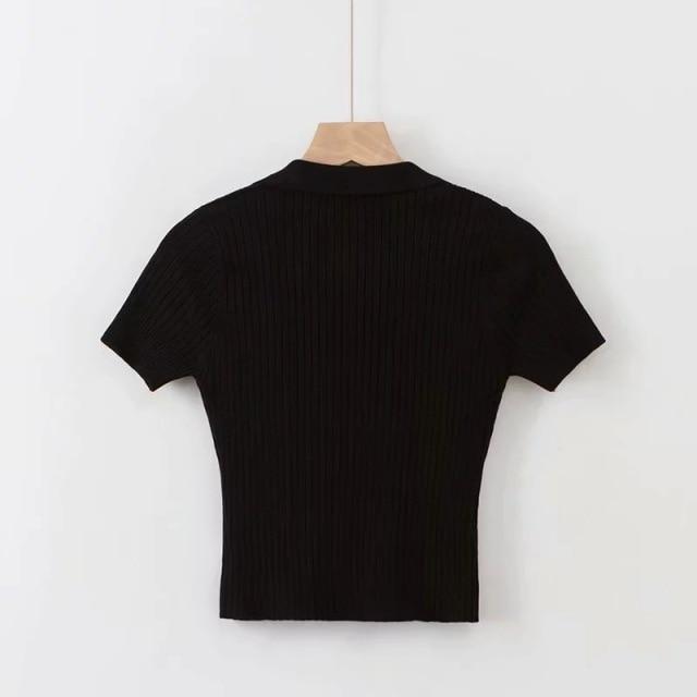 black Vintage ribbed women polo shirt crop top in vintage summer fashion with short sleeves solid and slim knit.