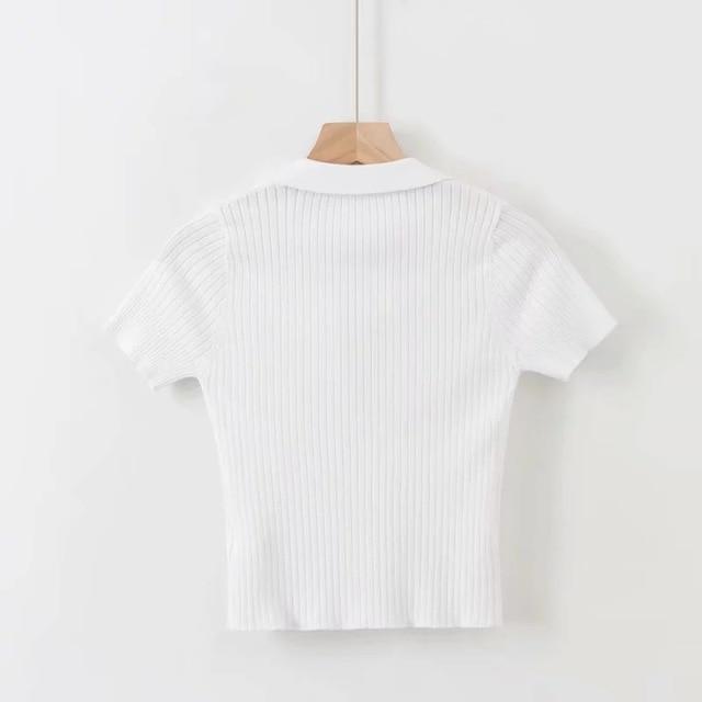 white Vintage ribbed women polo shirt crop top in vintage summer fashion with short sleeves solid and slim knit.