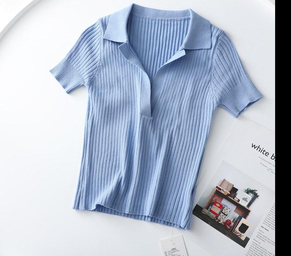 Light blue Vintage ribbed women polo shirt crop top in vintage summer fashion with short sleeves solid and slim knit.
