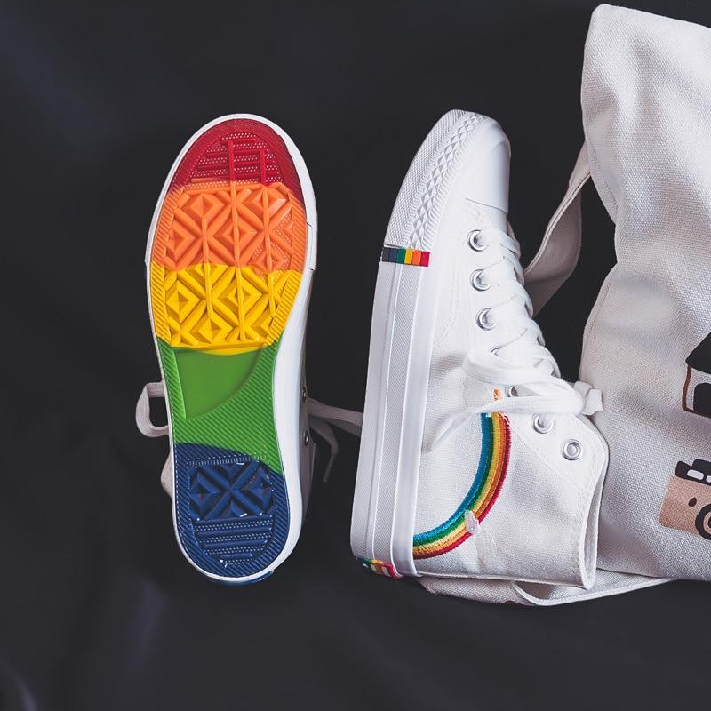 white classical high top converse style sneakers with a rainbow decoration in rainbow aesthetics fashion