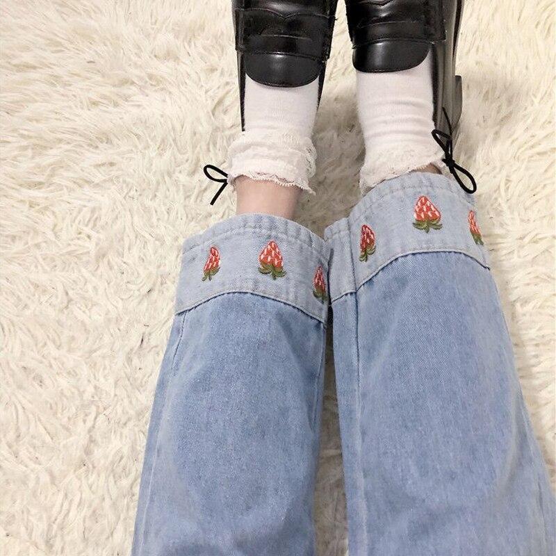 Cute Aesthetic Straweberry patchwork jeans. They come in the colors light or dark blue and are a perfect match for your aesthetic clothing look.