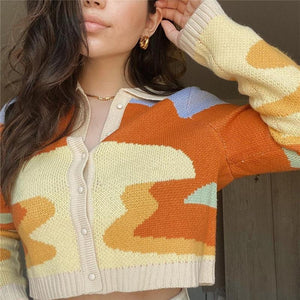 This sunset style cardigan sweater is the perfect outfit for your vintage clothing wardrobe. Explore our wide range of products for the best aesthetic shopping experience.